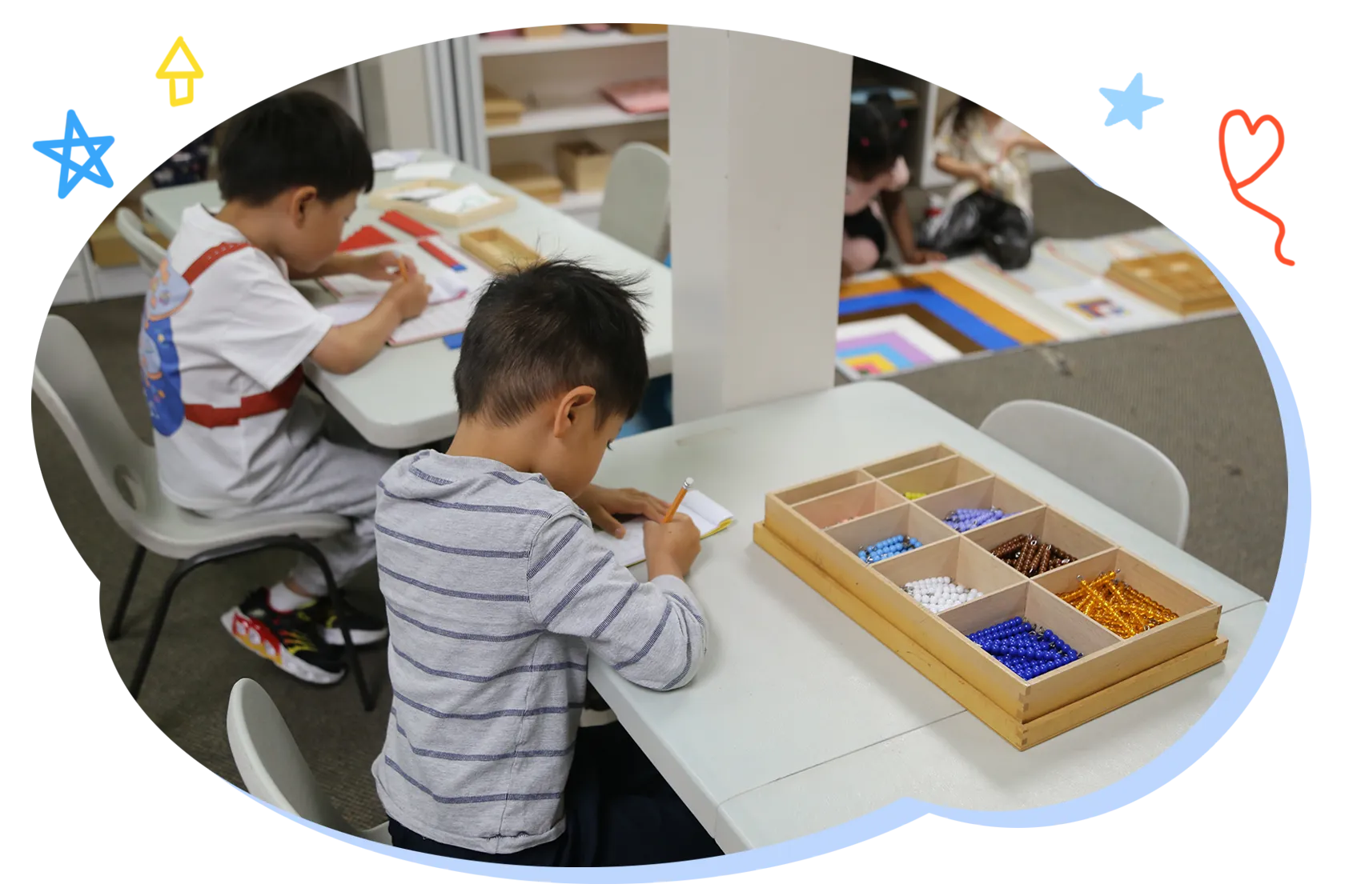 Children exploring Montessori materials in a Casa classroom